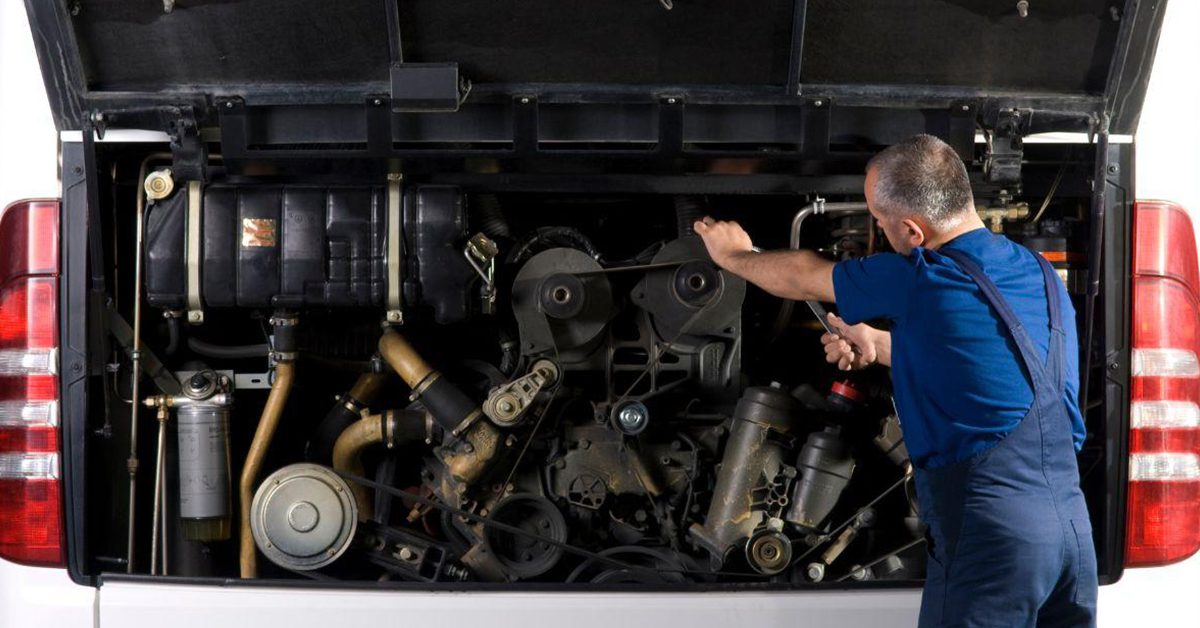 mechanic working engine of truck